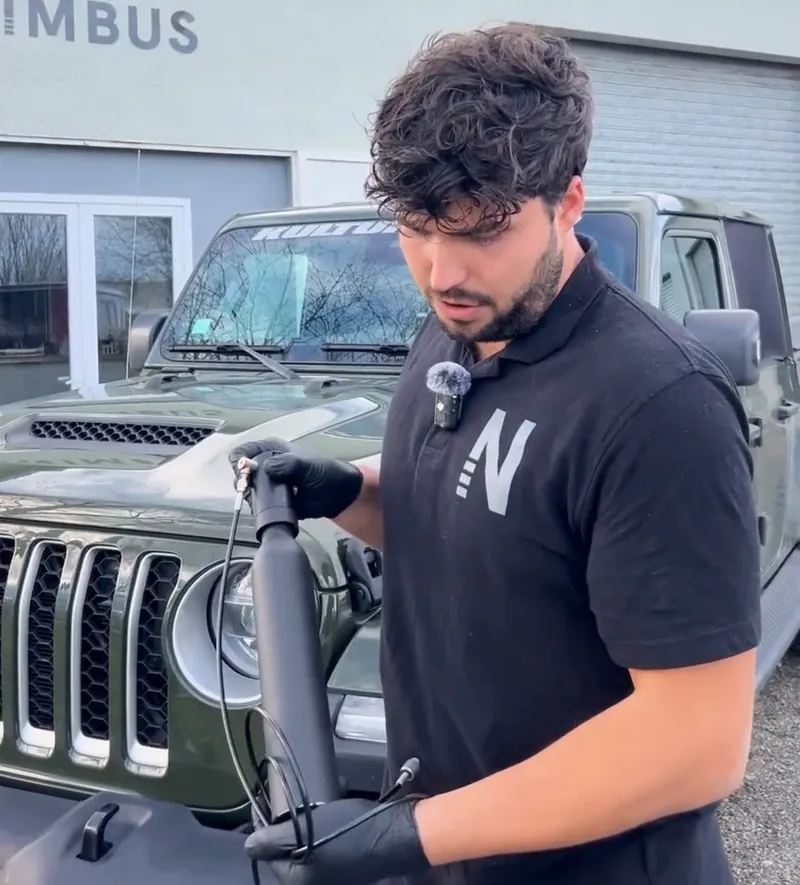 Killian with the ∆P head and hose in hand, ready to connect